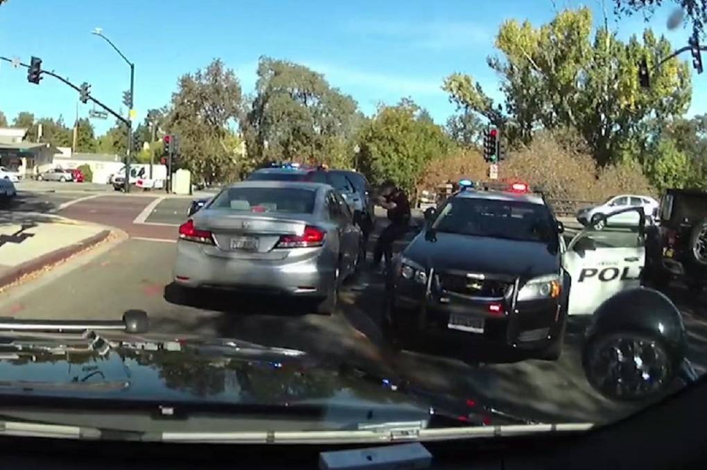 A Danville police car door-to-door alongside a Honda Accord, facing the opposite direction.
